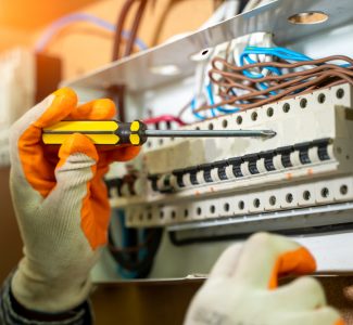 Electrician Installing Socket In New House