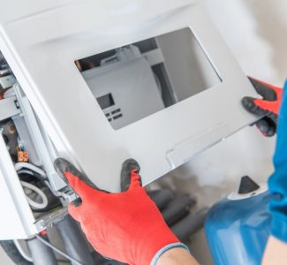professional technician repair gas furnace
